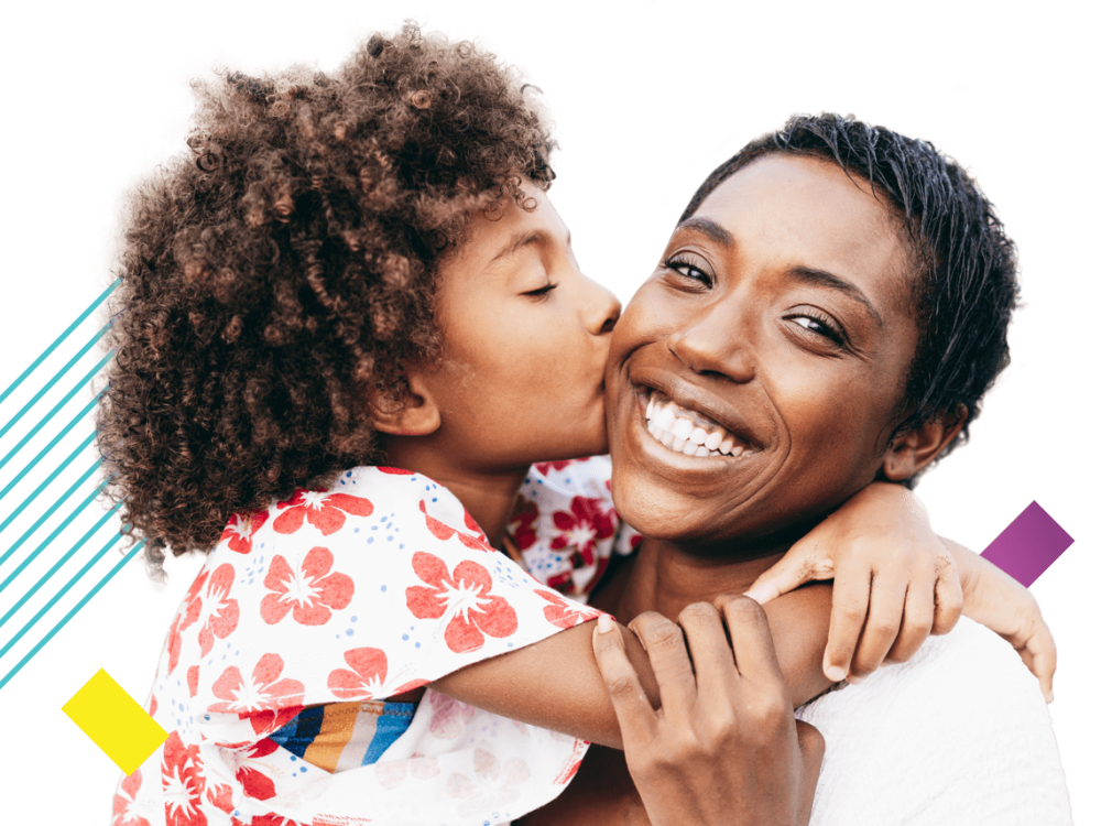 Image of woman and child, the child is kissing the woman's cheek